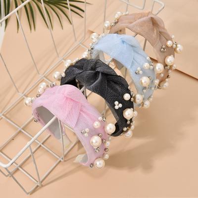 China 2021 popular new solid color mesh yarn fabric nail pearl headband headband for women wholesale wild fashion knotted headband for sale