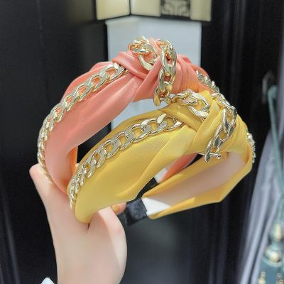 China 2022 European and American style spring and summer fabric knot headband headband fashion wholesale metal chain knotted headbands for women for sale