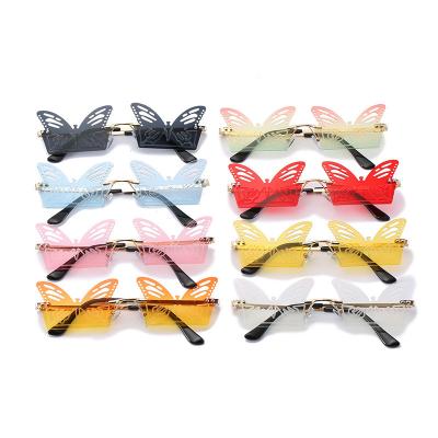 China New Arrival Durable Fashion Rimless Hollow Out Girls Women Piece Sun Glasses Butterfly Shaped Sunglasses UV400 for sale