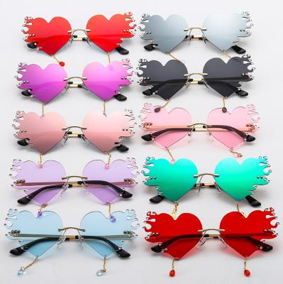 China Unique Durable Fashion Love Heart Tassel Teardrop Shape Women Eyewear Colorful Rimless Vintage Ocean Glass Sun Glasses Clear Sunglasses for sale