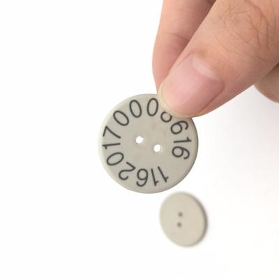 China 13.56mhz 2 Holes ISO15693 PPS RFID Waterproof / Waterproof Laundry Tag for sale