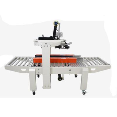 China Simple Operation Easy Maintenance Automatic Side Drive Carton Folding Sealing Machine With Tape for sale