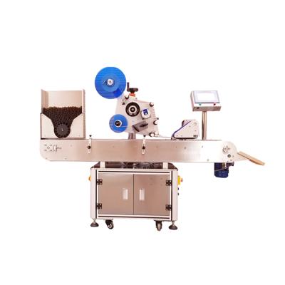 China Automatic horizontal food round bottle labeling machine small round tube self-adhesive labeling machine oral liquid labeling for sale