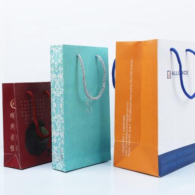 China Recyclable Custom Craft Paper Shopping Bag Logo Printed Cheap Package Bags for sale