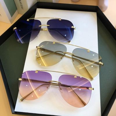 China Fashion sunglasses 2023 tendy sunglasses new retro mirror sunglasses women uv400 sun frame men rimless male unisex high quality frameless glass for sale