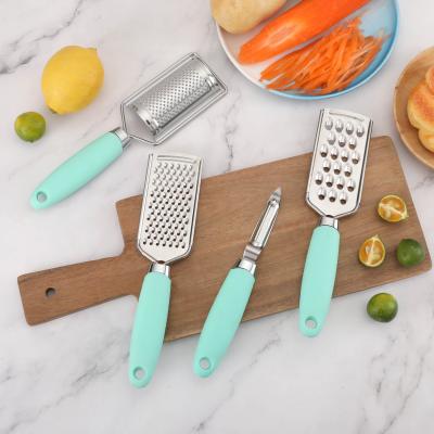 China Viable newcomer in stock stainless steel grater set of 4 with handle soft handle lemon zester cheese grater peeler grater set for sale