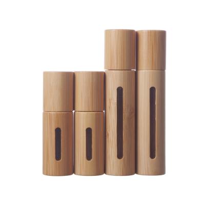 China Eco-friendly Perfume Bottle 5ml 10ml Clear Glass Essential Oil Roll On Bottle With Bamboo Cap Packaging for sale