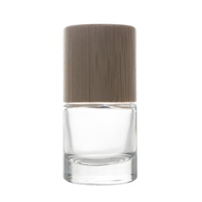 China Cosmetic Nail Polish Glass Bottle Bamboo / Wooden Cap Round Nail Polish Glass Bottle With Cylindrical Cap for sale