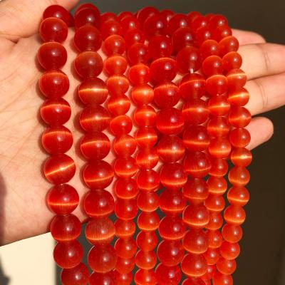 China Wholesale Cat Eye Stone Round Beads DIY Orange Polishing Red Glass Loose Opal Charm For Jewelry Making for sale