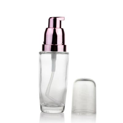 China 30ml Cosmetic Packaging Liquid Foundation Glass Bottle With Pump for sale