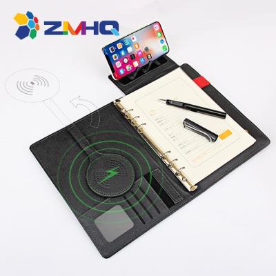 China PU spiral ringbinder premium agriculture moq bottom cover inside wireless charging pad with powerbank for sale