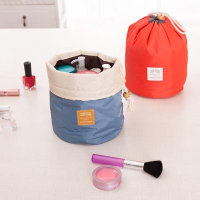 China Fashion Pouch Handbag Cosmetic Toiletry Bag Barrel Shaped Travel Cosmetic Bag Round Make Up Drawstring Bag for sale