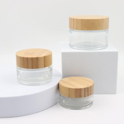 China 5g 10g 20g 30g 50g 100g Eye Cream Cosmetics Clear Empty Flat Glass Wholesale Skin Care Cosmetic Jars With Foil Cap And Cover for sale