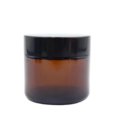 China Perfume 2oz 60g Amber Cream Glass Jar With Black Lid for sale