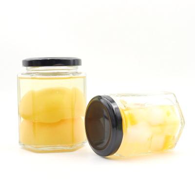 China Hexagonal Wide Mouth Glass Honey Canning Jars Honey Jam Food Packaging Square Storage Container With Tinplate Lid for sale