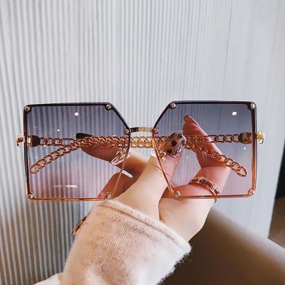 China Fashion Sunglasses Shape Charming Fashionable Rimless Crystal Sunglasses Summer Travel Oversized Chain Sunglasses for sale