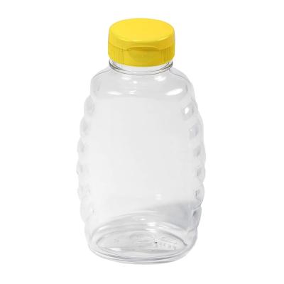 China Sustainable Clear PET Squeeze Honey Bottle Plastic Honey Jar 360ml 500g With Valve Lid for sale