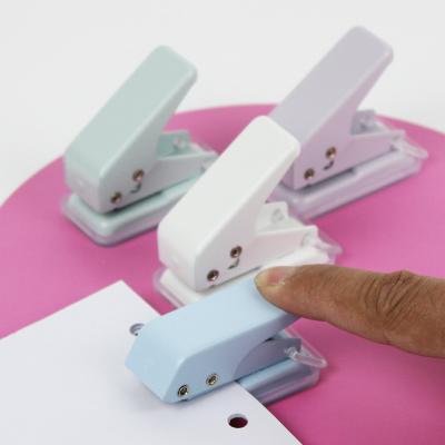 China Save the Work Simple Creative Manual Hole Punch Mini Punch Card Office Paper Binding Stationery Wholesale for sale