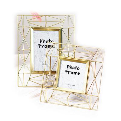 China Low MOQ Modern Style Simple Design Shape Photo Frame Gold Metal Geometric Picture Frames For Home Decor for sale