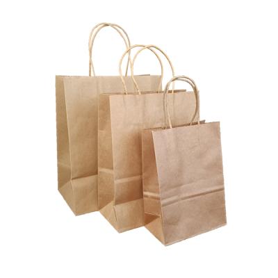 China Recyclable Wholesale Custom Printed Kraft Paper Shopping Bag With Handles Kraft Paper Bag Clothing Tote Bag for sale