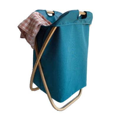 China Craftsman Large Canvas Laundry Bag Storage Basket Folding Decorative Cloth Laundry Hamper With Bamboo Frame for sale