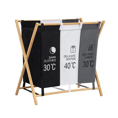 China Modern Magic Laundry Sorter 3 Section Laundry Hamper Bamboo Basket With 3 Compartments Large Storage Bin Wood Foldable Laundry Basket for sale