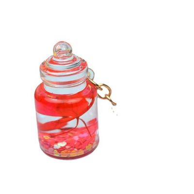 China Fashionable creative transparent liquid bag pendant quicksand bottle pendant key chain small glass bottle gift accessories for sale