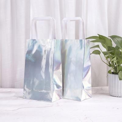 China Recyclable Luxury Shiny Silver Reusable Laser Film Reusable Cardboard Shopping Cosmetics Packaging Paper Bag for sale