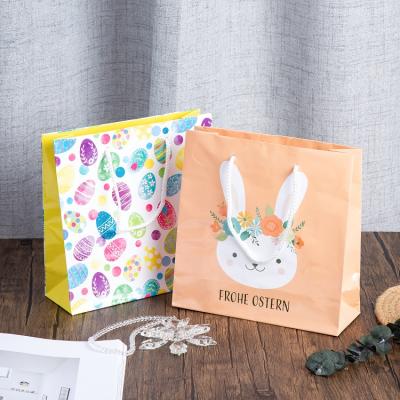 China Zhejiang Recyclable Wholesale Cheap Easter Gift Bags Custom Design Shopping Paper Bags With Customer Logo for sale