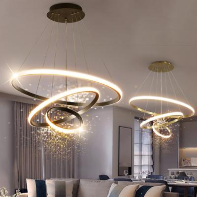 China Nordic Modern Simple Design Hanging Light Acrylic Gold Circle Silicon Luxury Modern Chandelier Lamp Decorative Rings Pendant for sale