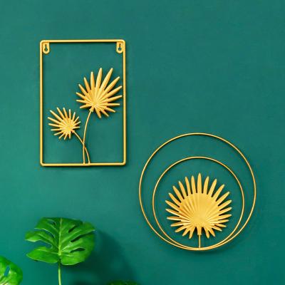 China Art Metal Gold Ginkgo Maple Monstera Iron Art Creative Palm Leaf Decorative Hangings Nordic Home Living Room Iron Art Decor for sale