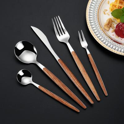 China Sustainable Silver Stainless Steel Cutlery Sets With Imitation Wood Handle For Wedding Restaurant Festival for sale