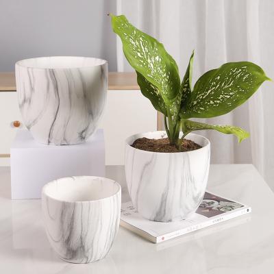 China Modern Creative Nordic Modern Marbled Flower Pots Ceramic Green Planter for Home and Garden Decor for sale