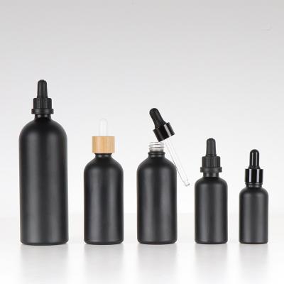 China Personal Care 30ml Matte Frosted Black Glass Dropper Bottle 1.01 oz Essential Oil Bottle With Gold Dropper Cap for sale