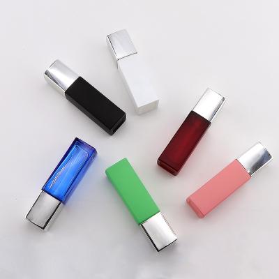 China Personal Care IN STOCK 40ml Square Shape Glass Red Blue Colorful Bottle With Face Cream Container And Lotion Pump Cosmetic Bottles for sale