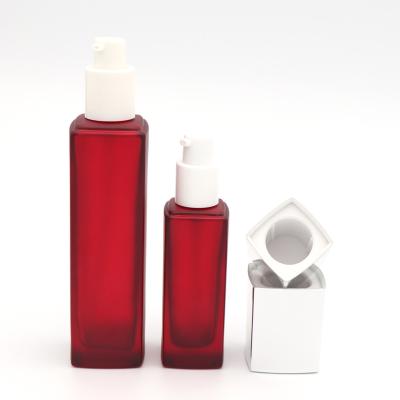 China Personal Care Hotsale 1 Ounce 30g 50g 40ml 100ml 120ml Matte Red Square Rectangular Lotion Glass Bottle With Silver Lid for sale