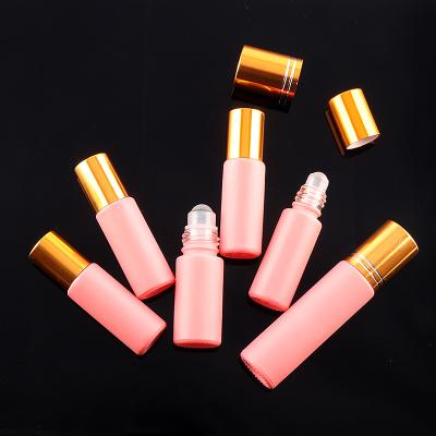 China Personal Care Fancy Matte Pink and Rainbow Color 10ml Essential Oil or Perfume Roller Glass Bottle with Gold Cap for sale