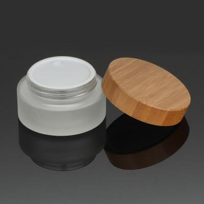 China Amber Frosted Fancy Cosmetic Personal Care Glass And Bamboo Wood Jar 15g 30ml 50ml 100ml Jars Lid Cream Jars for sale