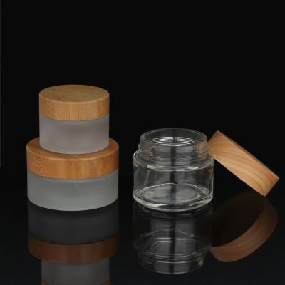 China Personal Care 5ml 15ml 30ml 50ml 100g Empty Clear Matte Glass Cosmetic Cream Jar With Natural Bamboo Lids for sale