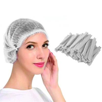 China Non-Woven Viable Hair Elastic Waterproof Bloating Elastic Cover Disposable Bath Hotel Salon Spa Nonwoven Shower Hats for sale