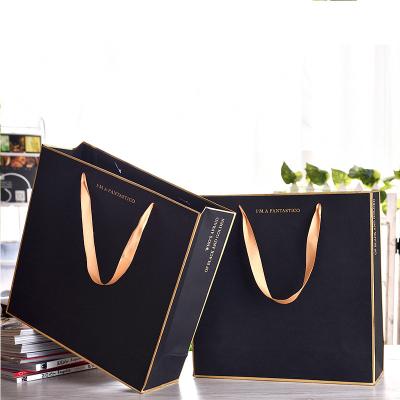 China Wholesale Custom Printed Logo Luxury Black Shopping Paper Recyclable Pouch Wrapping Paper Manufacturers Gift Wrapping Bags for sale