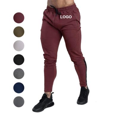 China QUICK DRY Logo Printed Gym Male Athletics Active Wear Stacked Sweat Custom Track Mens Jogger Pants With Side Pockets for sale