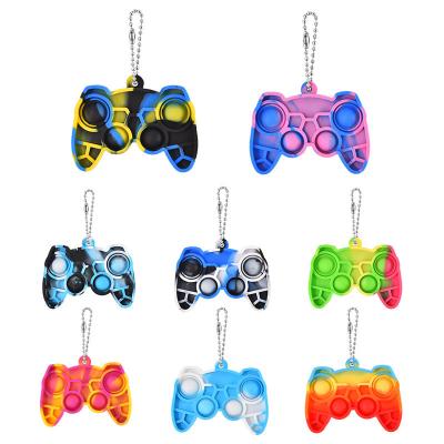 China Silicone Mini Stress Reliever Push Bubble Sensory Bouncing Person Toys New Design Silicone Key Chains Jumping Toy for sale