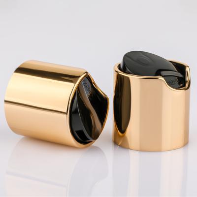 China Tassel 20/410 Shiny Gold Aluminium Disc Top Cap With Black Top For Shampoo Body Lotion for sale