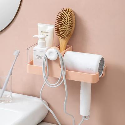 China Self-adhesive Wall Mounted Bathroom Wall Storage Shelf Hairdryer Holder Viable Multifunctional Universal Fan Rack for sale