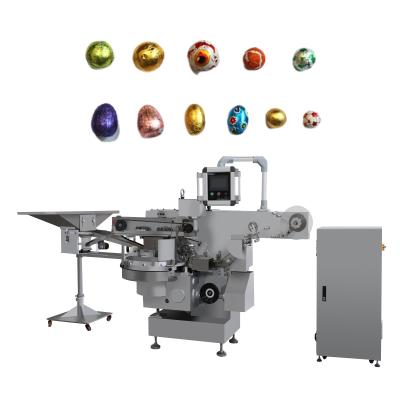 China Función principal cepillado esférico 300-500ppm máquina automática de embalaje de huevos de chocolate en venta