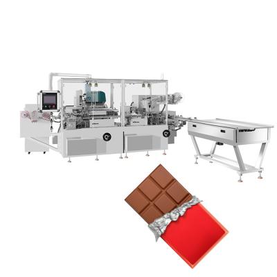 China Chocolate Tablet Packaging Machine with Double-layer Wrapping Heat-sealing and Glueing for sale