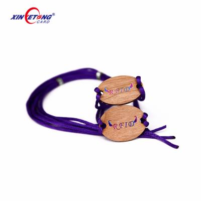 China Waterproof / Waterproof Eco-friendly RFID Tag 13.56Mhz HF 1K String RFID Wooden Wristband For Resort Access Control for sale