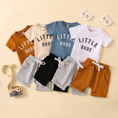 China Breathable Factory Direct Children's Wear Round Neck Letter Printed Top Solid Color Shorts Two Piece Set for sale