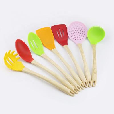 China Sustainable 7 Pcs Amazon Hit Silicone Kitchen Utensil Sets Wooden Handle Kitchen Accessory Stick Non Cooking Tools for sale